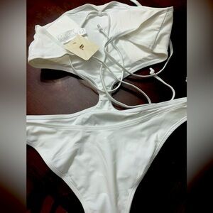 Brand new white,one piece, cut out bathing suit from Fabletics
